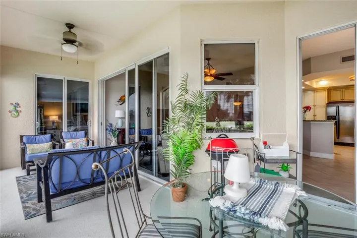 View of patio featuring a ceiling fan and outdoor dining area