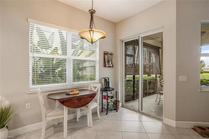 Dining space featuring baseboards and light tile patterned flooring