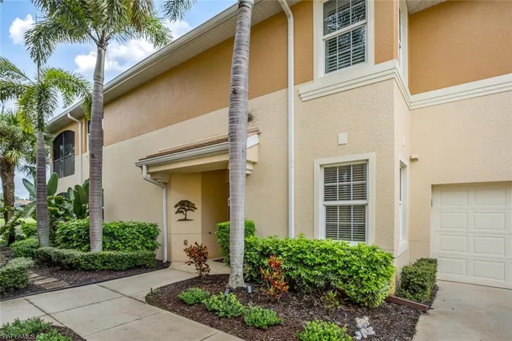 Property entrance featuring stucco siding