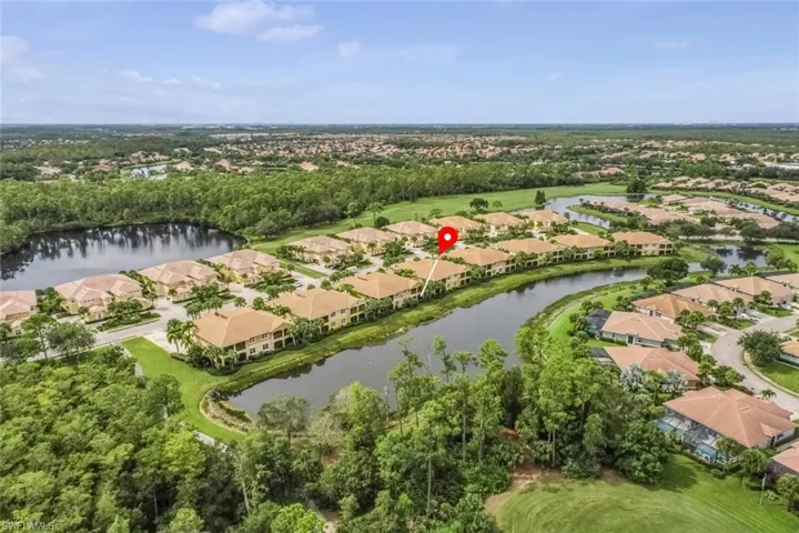 View of property location featuring nearby suburban area and a nearby body of water