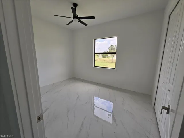Spare room featuring ceiling fan