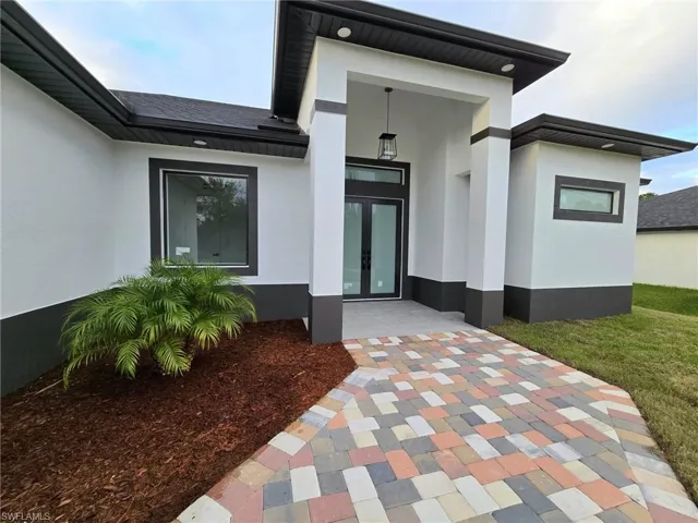 Doorway to property featuring a patio area and french doors