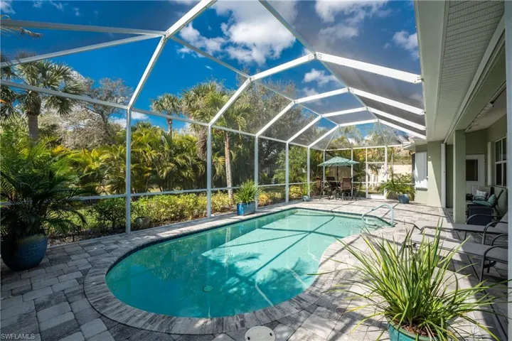 View of pool featuring a lanai and a patio