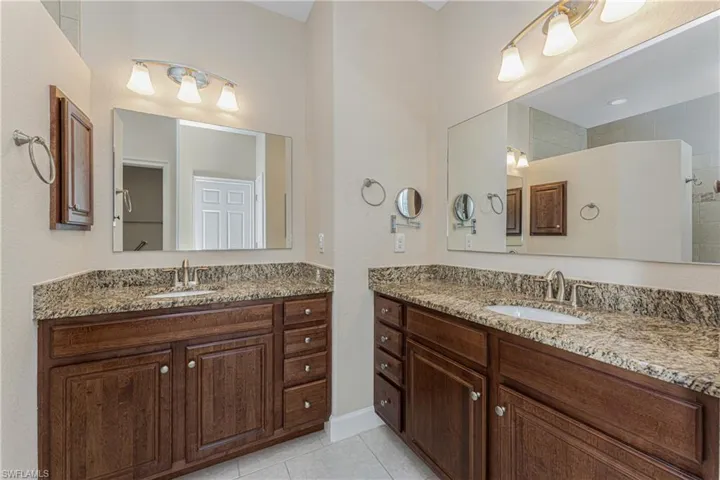 Bathroom with vanity and tile patterned floors