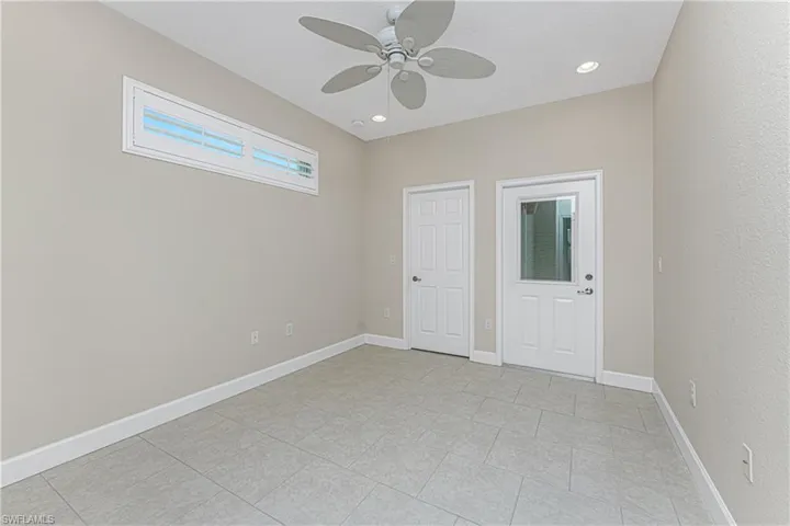 Unfurnished bedroom featuring ceiling fan