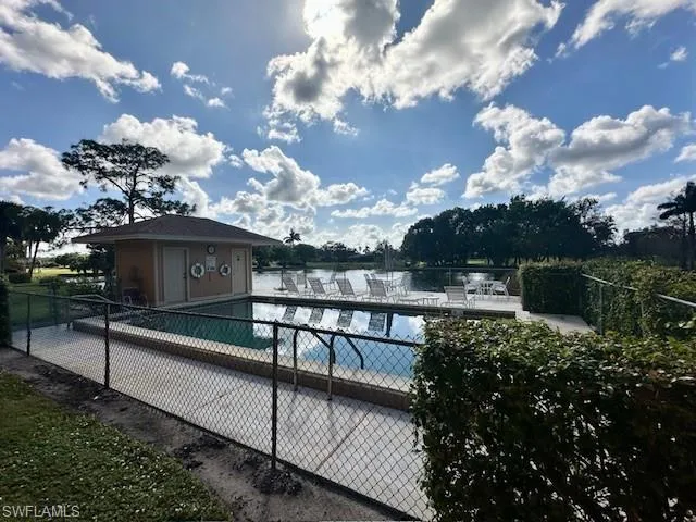 View of pool with an outbuilding