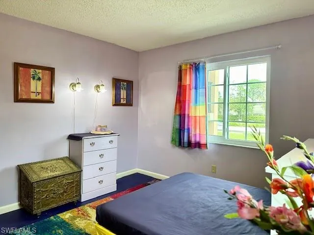 Bedroom with a textured ceiling