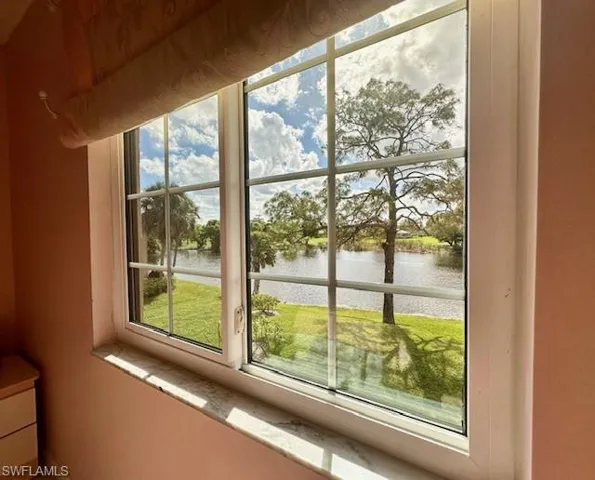 Doorway to outside featuring a water view