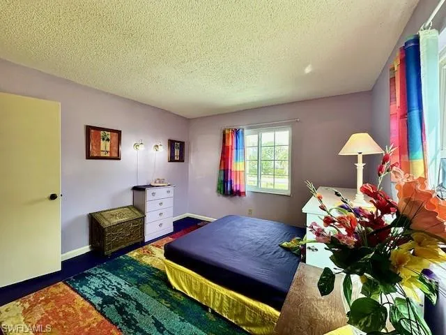 Bedroom with a textured ceiling
