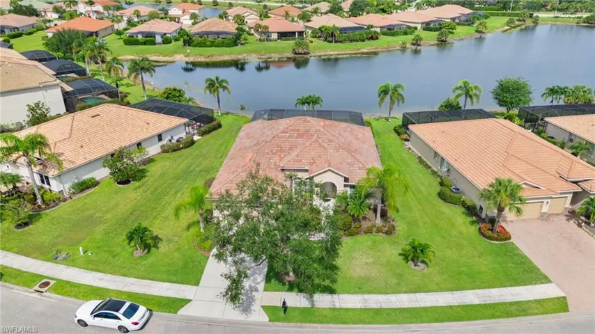 Aerial view of residential area featuring a large body of water