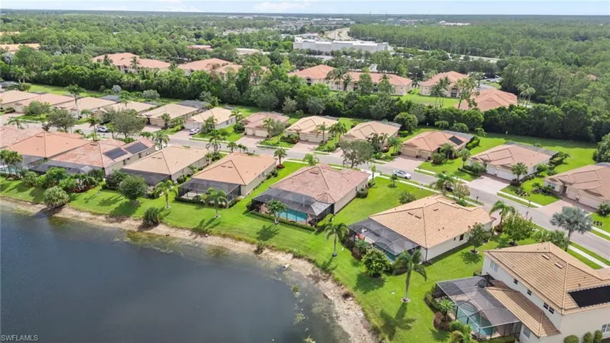 Aerial view of residential area with a large body of water