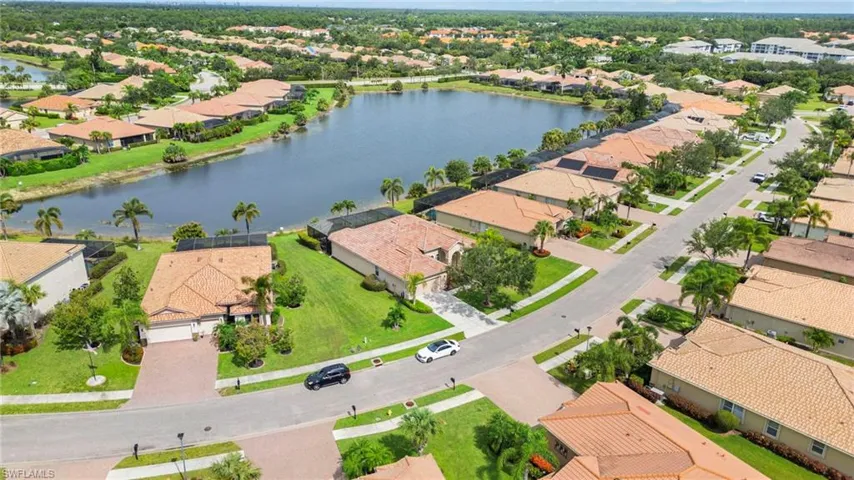 Aerial overview of property's location with nearby suburban area and a large body of water