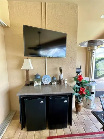 Outdoor bar area with 2 mini fridges