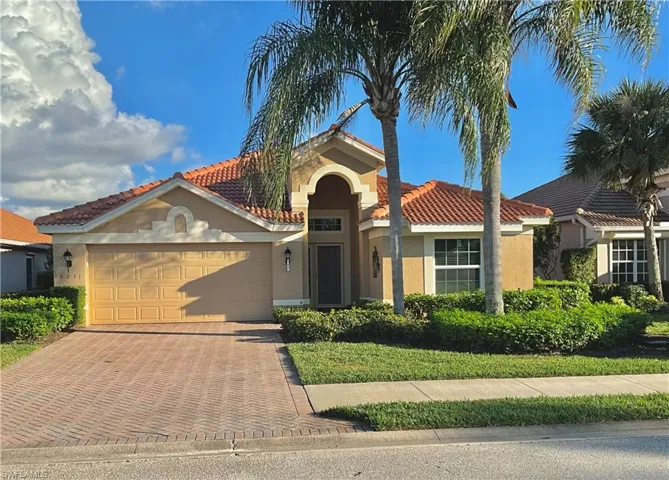 Mediterranean / spanish-style home featuring a garage