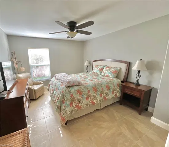 Flex Den/Bedroom with ceiling fan and French doors