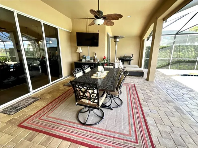Sunroom featuring ceiling fan
