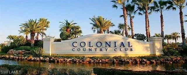 Community sign with a water view