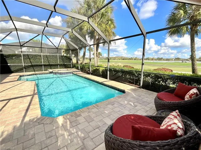 View of pool featuring a lanai and a patio area