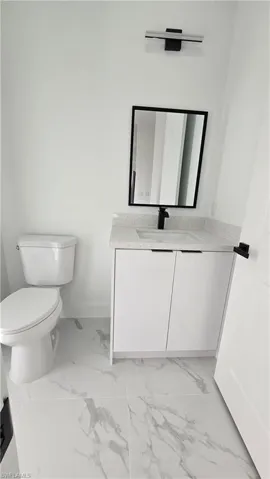 Half bathroom with exterior door