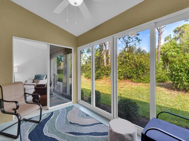 Sunroom with vaulted ceiling and ceiling fan