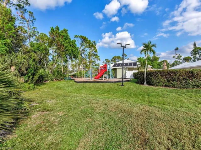 View of yard featuring a playground