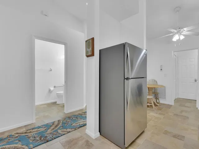 Kitchen featuring stainless steel fridge and ceiling fan