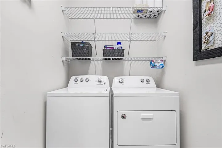 Indoor laundry room with shelving