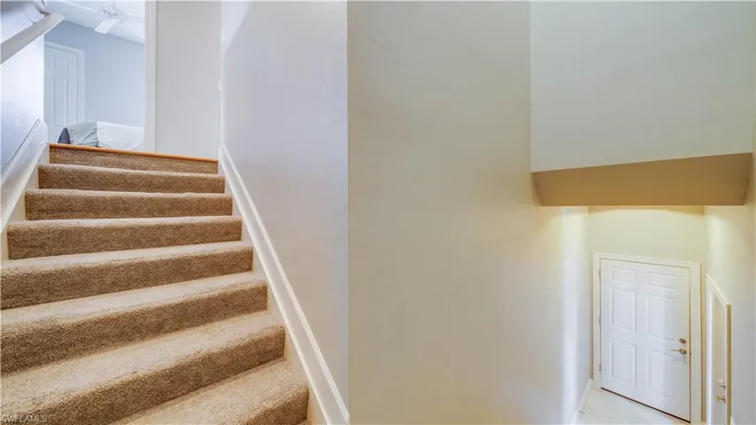 Stairs up to Home, Garage door to the right