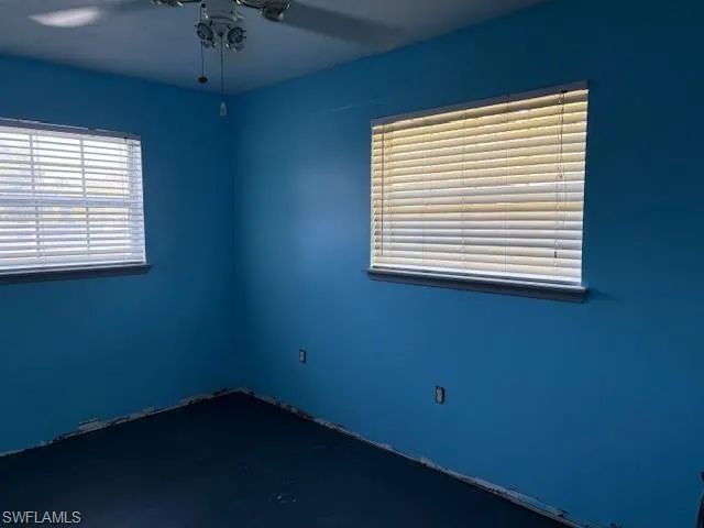 Empty room featuring a ceiling fan