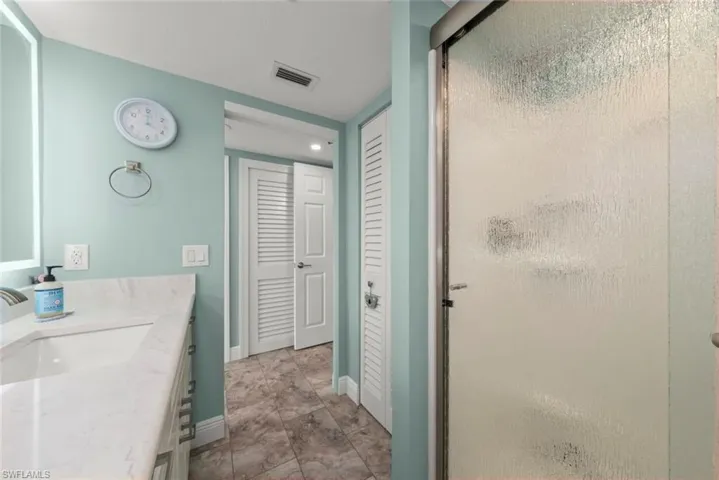 Primary bath with shower and linen closet