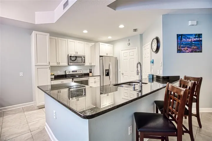 Extended countertop, new white cabinets and an extra cabinet