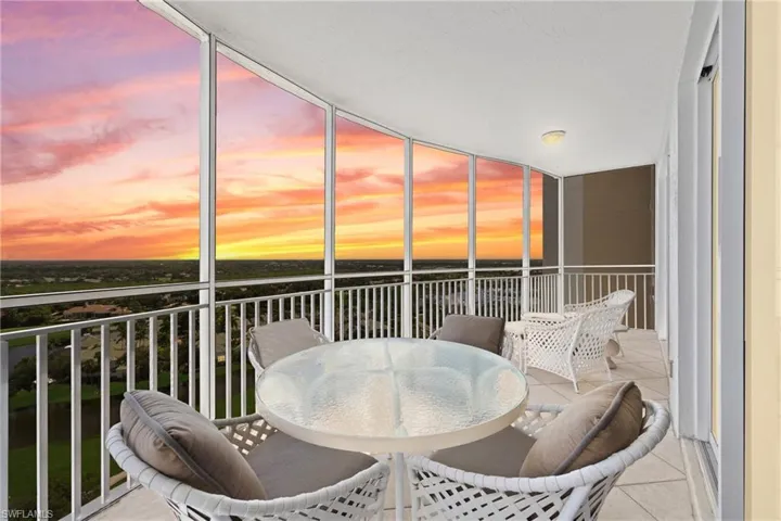 Expansive balcony with floor-to-ceiling windows, offering panoramic scenery