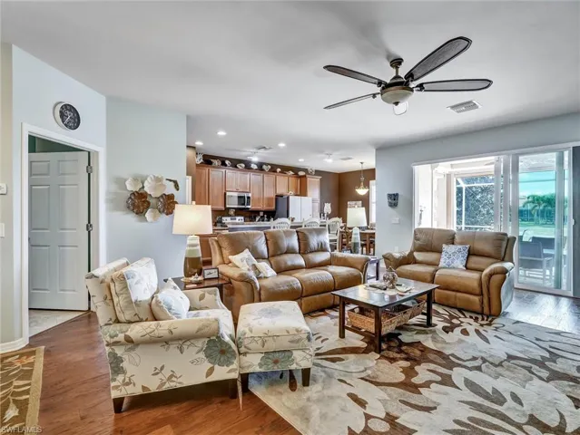 Living area featuring hardwood / wood-style flooring, recessed lighting, and ceiling fan