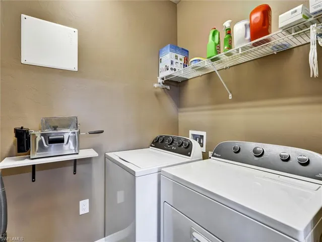Laundry area featuring washer and clothes dryer