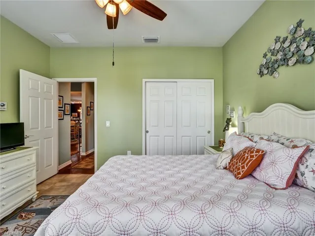 Bedroom with a closet and ceiling fan