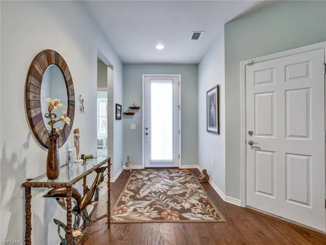 Foyer entrance featuring dark wood-type flooring and recessed lighting