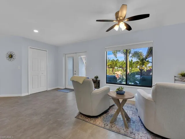 Living area featuring french doors, recessed lighting, and ceiling fan