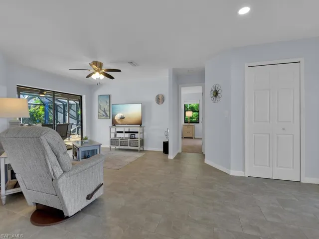 Living area featuring plenty of natural light, ceiling fan, and recessed lighting