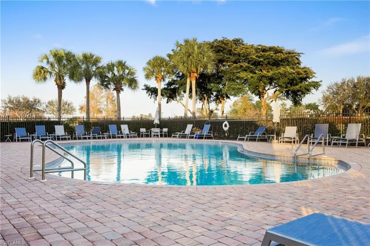 Community pool featuring a patio
