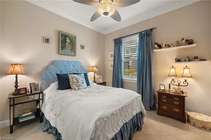 Bedroom featuring ceiling fan and ornamental molding