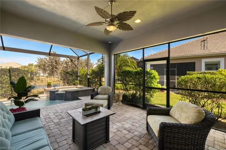 Sunroom / solarium featuring ceiling fan