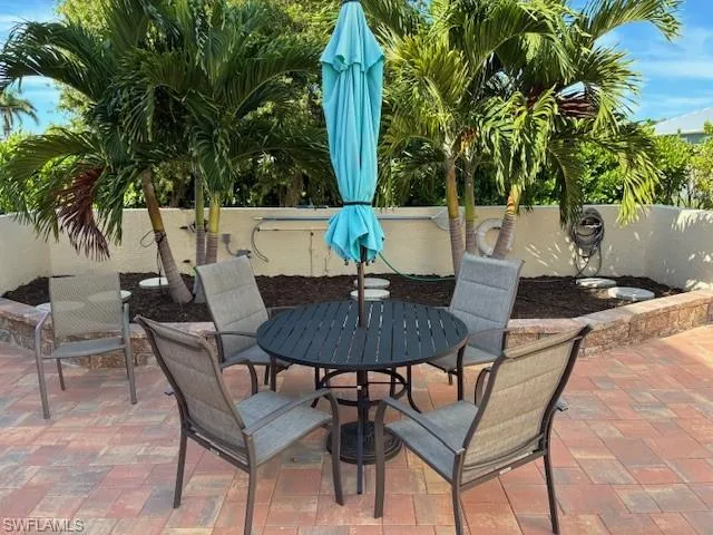 Fenced backyard with a patio and outdoor dining space