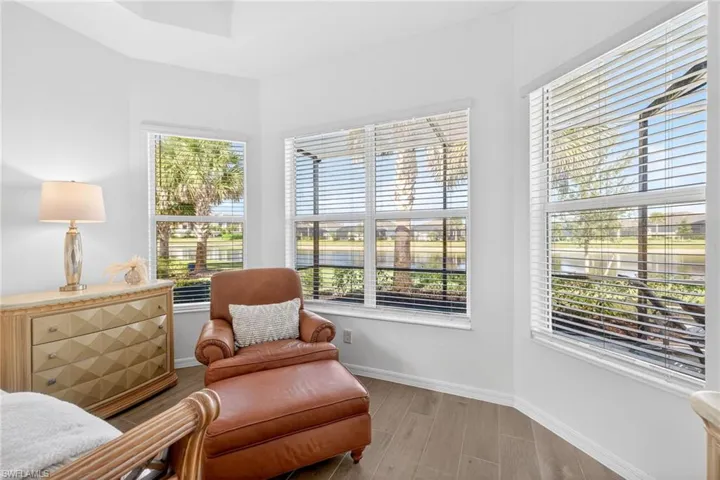 Living area with wood finish floors and baseboards