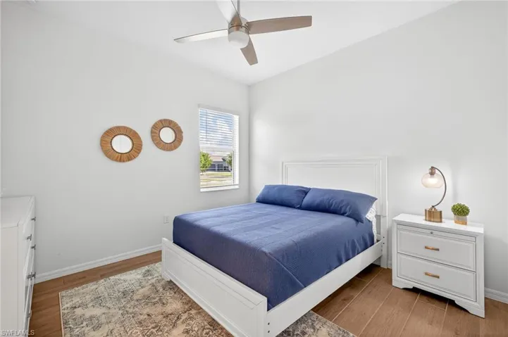 Bedroom featuring light wood-type flooring and ceiling fan
