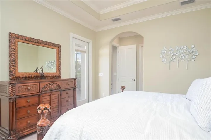 Bedroom featuring crown molding