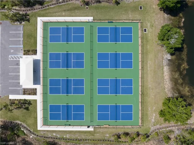 Eight pickleball courts with perimeter fencing