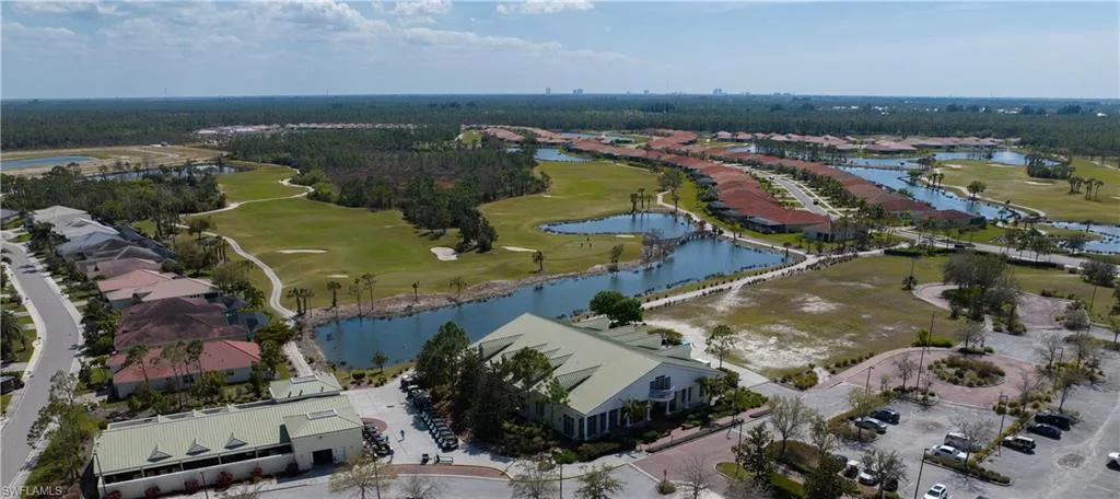 Expansive golf course community featuring multiple water features, mature landscaping, and an on-site clubhouse