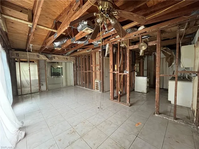 Basement featuring tile flooring and washer / clothes dryer