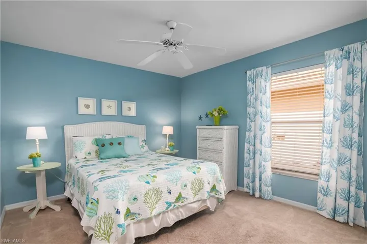 Bedroom featuring carpet and ceiling fan