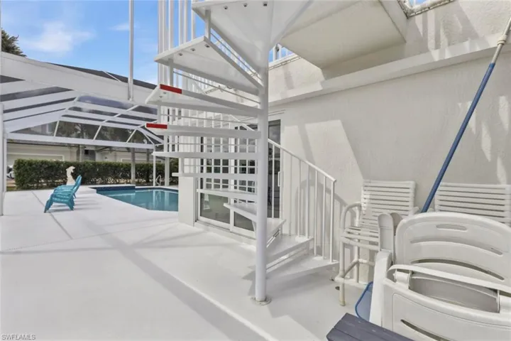 Spiral staircase leading to 2nd floor additional balcony.